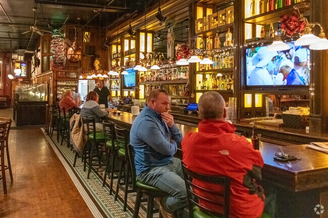 The bar at Fitzwilly's is a spot to meet friends and enjoy a beverage in a warm atmosphere.