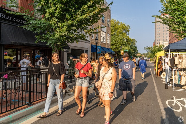 Laurel residents stroll along Main Street during Salisbury 3rd Friday's golden hour.