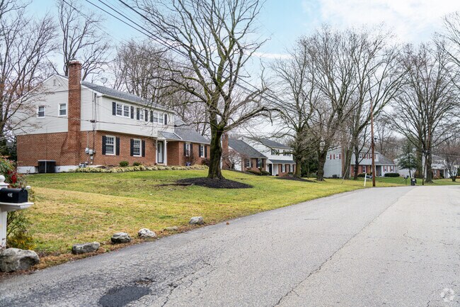 A split-level is flanked by two colonials on this street in Rose Valley.