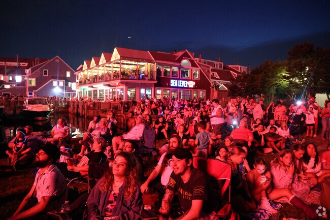 The night sky comes alive with vibrant colors during the Salem 4th of July Celebration, as fireworks light up the horizon in a dazzling display.