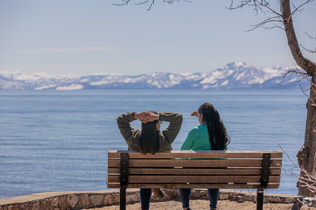 Two friends savor serene views of the lake in Kings Beach.