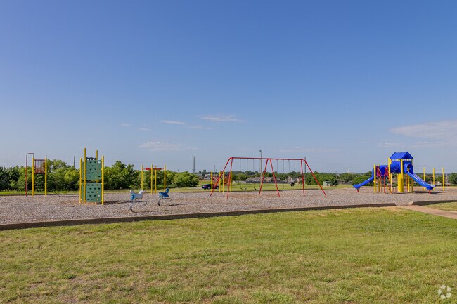 East Side Park near MacArthur High offers playground and picnic spots for Sullivan Village locals.