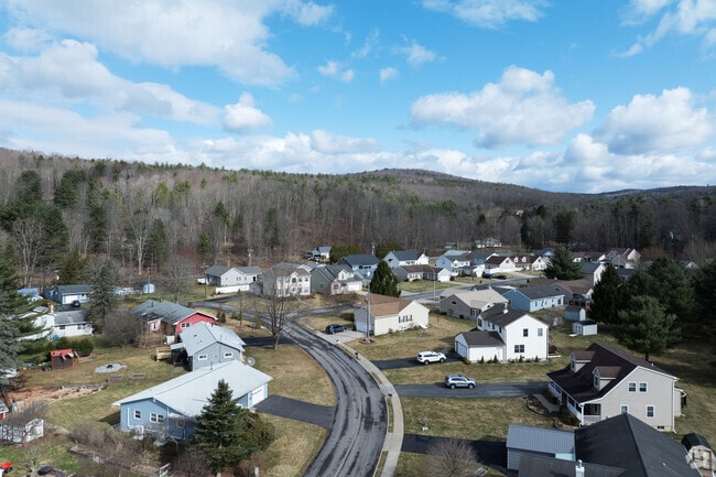 Just outside downtown Oneonta, quaint subdivisions of contemporary homes line winding streets.