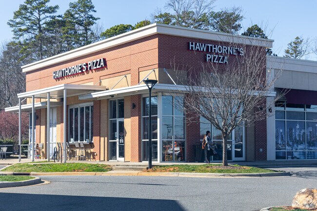 Shopper browses quaint shops, discovering treasures in East Forest.