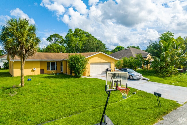 Homes with manicured lawns line Cashmere Cove’s quiet streets.