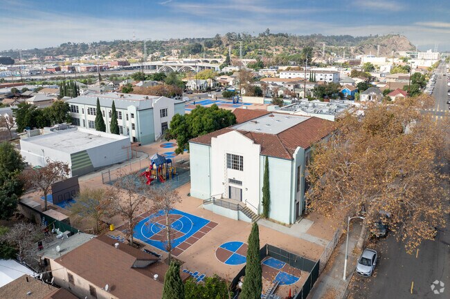An outdoor sports area with basketball hoops is offered at Albion Street Elementary School.