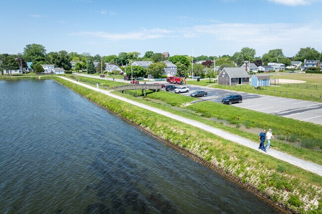 People enjoy taking outdoor walks by Easton Pond, which is situated in Easton Pond, RI.