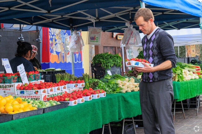 Picking up the fresh strawberries at Bellflower Farmers Market.