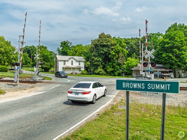 Cars cross the iconic railroad intersection marking the heart of Browns Summit.