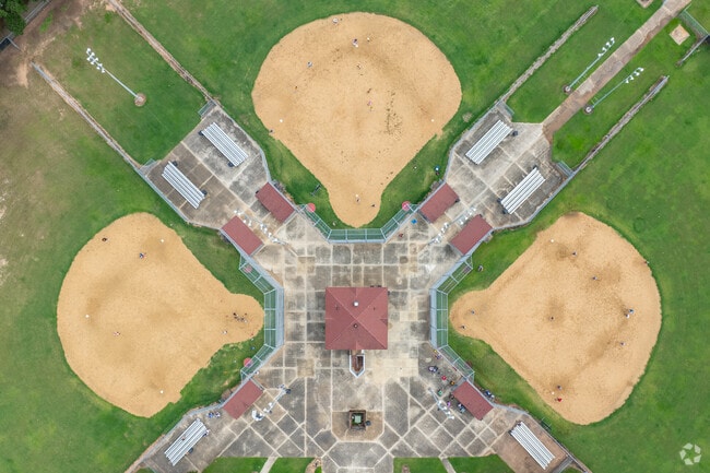 Residents of the Garden District enjoy playing baseball on weekends.