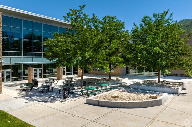 A courtyard with trees and sitting areas at Hillside Middle School.