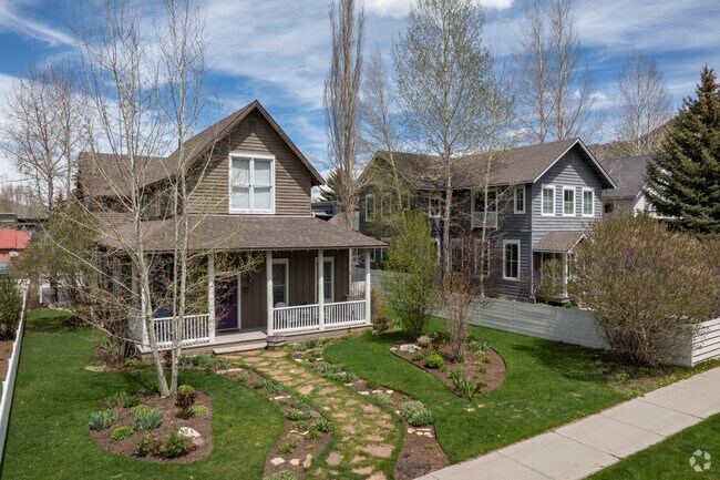Charming Craftsman style homes with picket fences line the streets in Jackson.