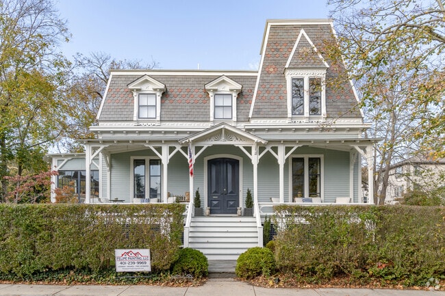 This Victorian home has an elegantly decorated slate roof and full porch in Old Beach.