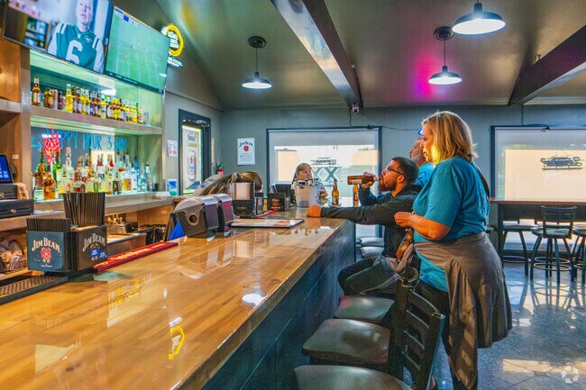 Enjoy happy hour from 3 to 6 PM inside Double Hill Bar & Grill in Presquille.