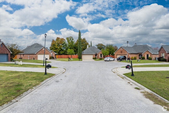A row of brick homes sit along a quiet cul-de-sac road in central Youngsville, Louisiana.