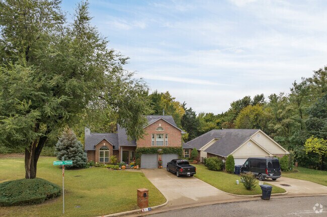 Stately homes in The Oaks stand amid autumn's splendor.