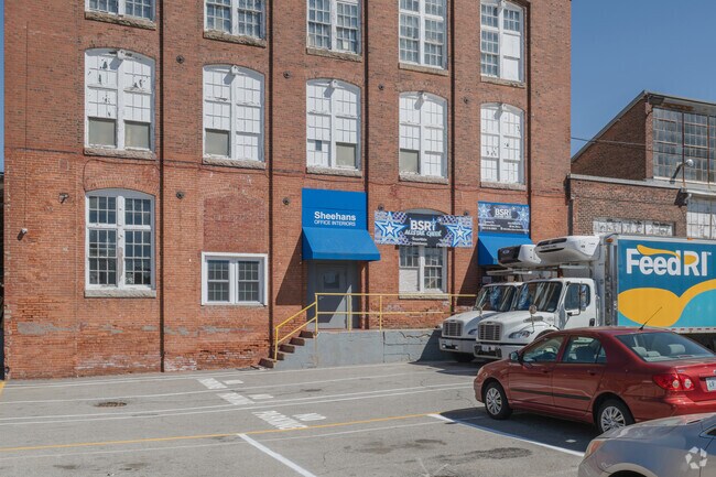 Old mill buildings in the Phillipsdale neighborhood have been repurposed to support local businesses.