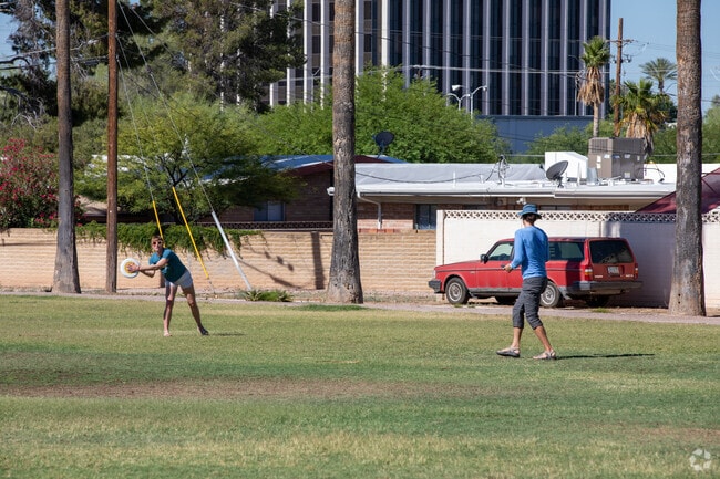 Highland Vista residents playing frisbee in Highland Vista Park.