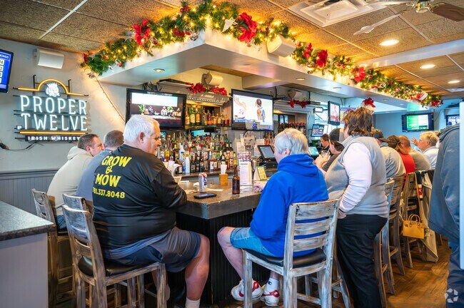 Enjoy a cold beer and mouthwatering wings at Alumni Sports Café in North Pembroke.
