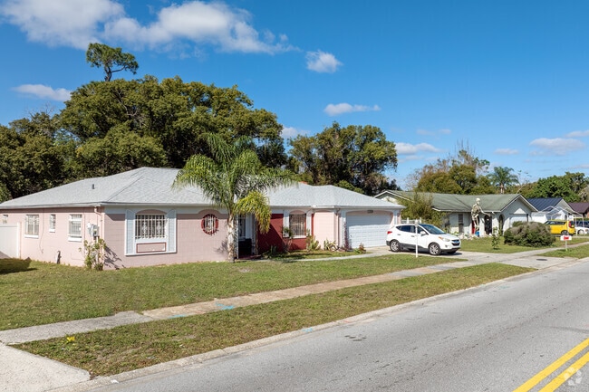 Mature trees line Goldenrod backyards, providing privacy for homeowners.