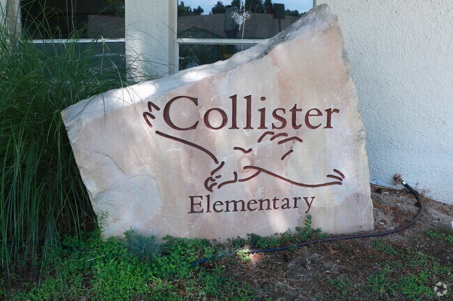 A stone with Collister Elementary School's insignia welcomes its students.