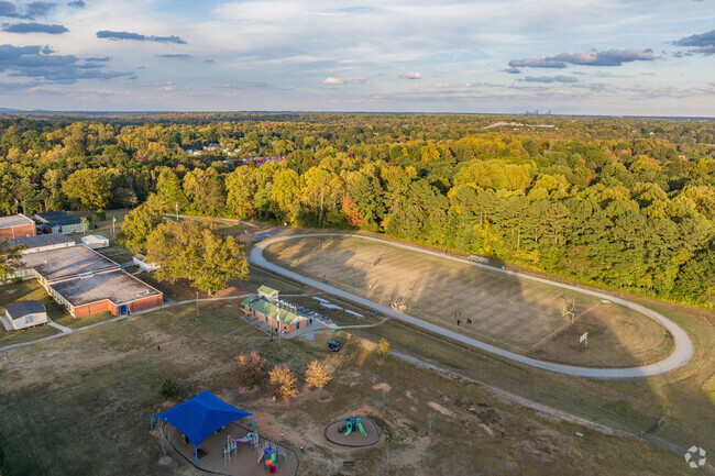 Southwest Elementary features amenities such as a large playground, track, and football field.