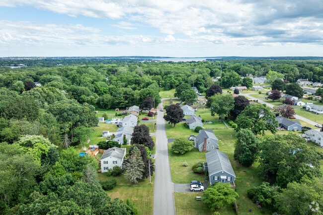 Aerial view showcases North Swansea, MA adorned with lush greenery.