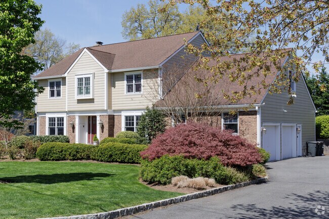 A raised ranch style home in Madison, NJ comes with a two car garage.