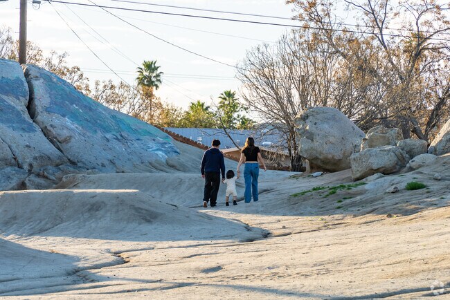 Exploring outdoor adventures with the family at Enchanted Hills Park hiking playground.