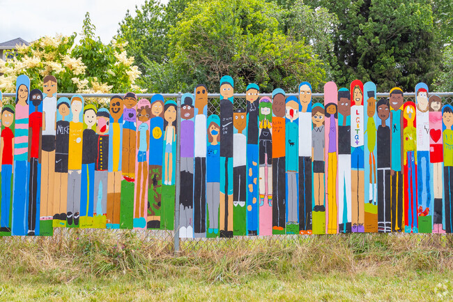 Students art brightens the fence around  the Woodlawn K-5 School.
