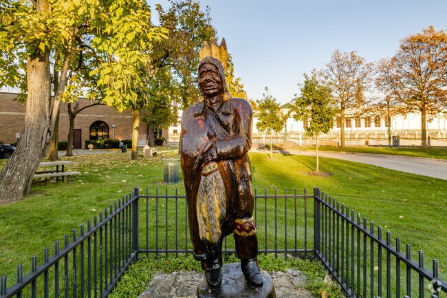 Native American sculpture created by Elmer D Hickory located in Billie Limacher Park.