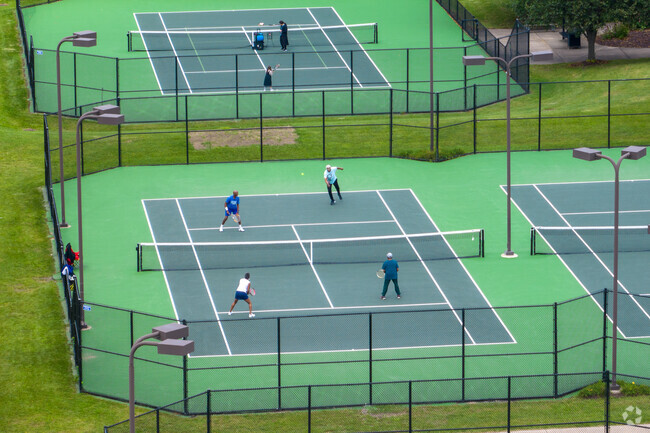 Two couples spend an afternoon in a doubles match near Lathrup Village.