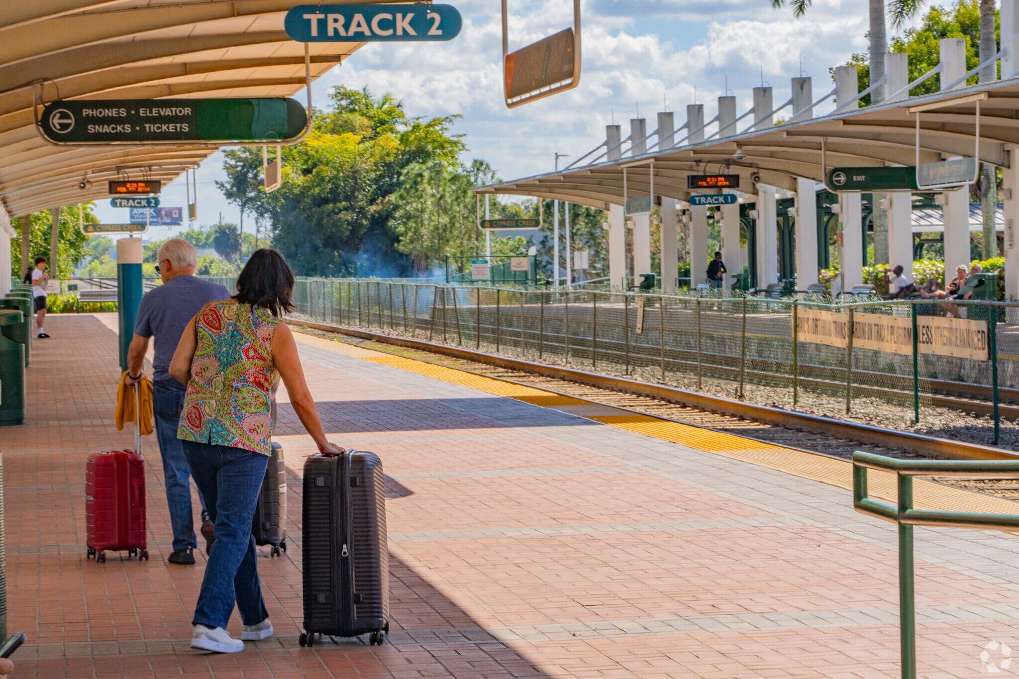 Passengers arriving at the Train Station in Palm Aire Neighborhood.