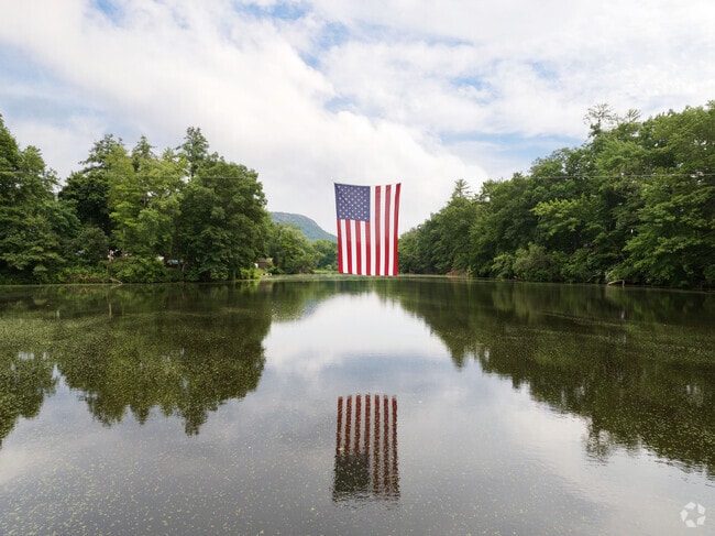 An American flag hangs proudly over Nashawanuck Pond in Easthampton.
