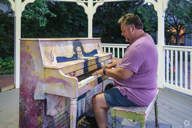 A local man plays a tune on a public piano in Sewickley near Ben Avon Heights.