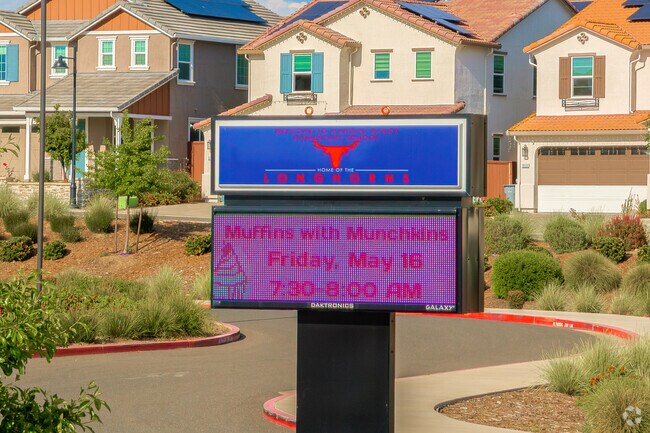 The digital sign front of Mangini Ranch Elementary displays important information.