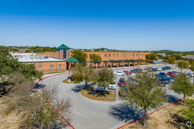 The school is named after Julia Newton Aue, a dedicated educator.