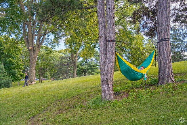 Powderhorn Park is a great place to relax with a hammock and read.