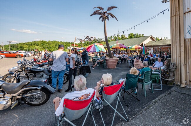 Friends hang out at Coconut Joe's Tiki Bar with food, drink, and great conversations.