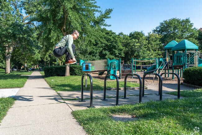 Raymond Park offers a peaceful green escape in Downtown Evanston, perfect for strolls, playtime, and picnics.