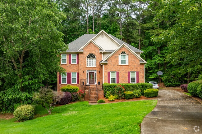 Classic brick homes with manicured landscaping give Audubon Forest a timeless and established character.
