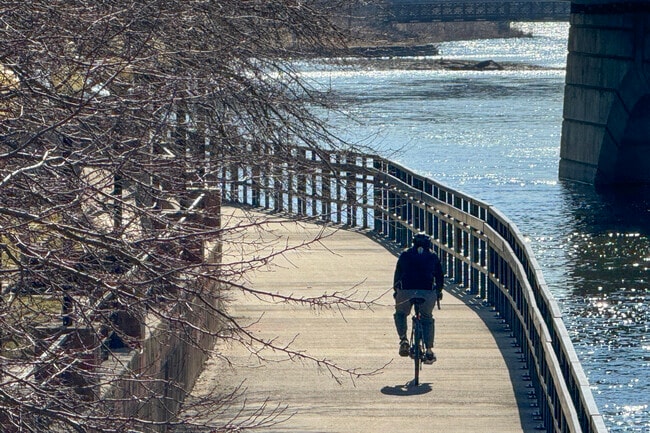 Cyclists enjoy the Fox River Trail’s scenic route through Southeast Batavia.