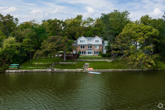 Many homes in Tower Lake Park are right by the water with small boats for leisure.