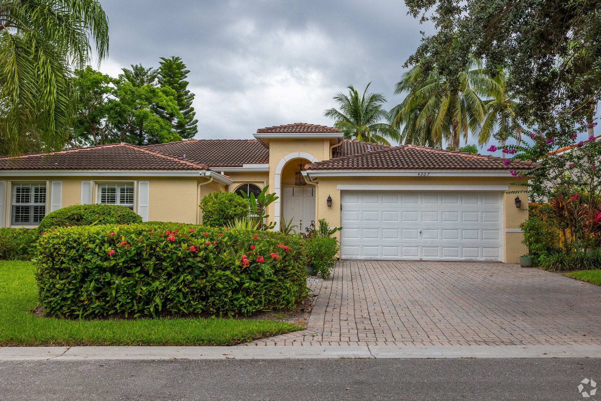 Mediterranean single family home in Palm Beach Farms neighborhood.