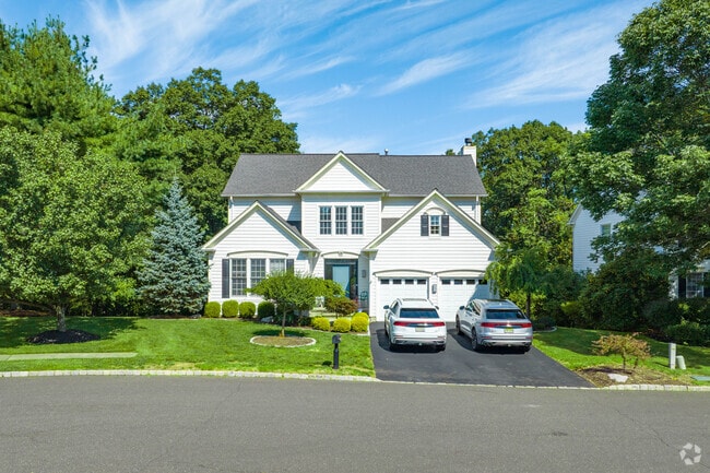 Mature trees shade Bedminster’s large single-family homes along quiet residential streets.