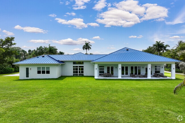 Modern ranch style home with large front yard in Outer Davie neighborhood.