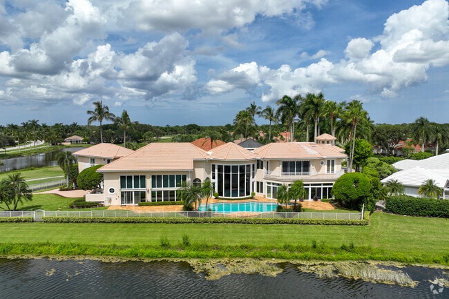 Lakeside living in The Acreage often includes large, multi-story homes with expansive yards.