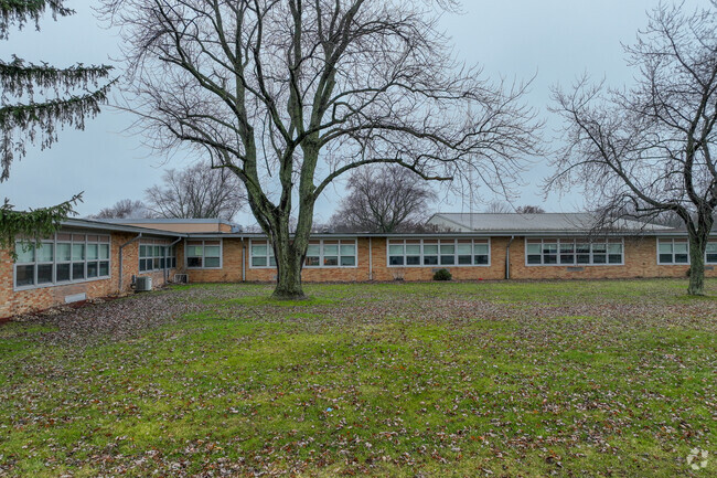 Ethel R Jones Elementary School is surrounded by mature trees.