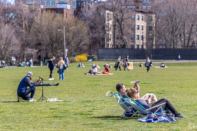 Residents of Brookline enjoy the 2024 Solar Eclipse at Amory Playground.