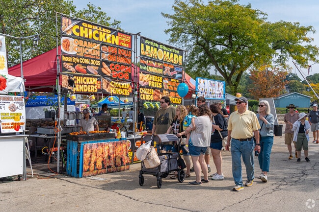 Families stroll the food court during Heritage Fest in West Dundee.
